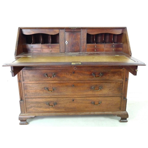 910 - A George III mahogany bureau, fall front with fitted interior, secret compartments, drawers and shel... 