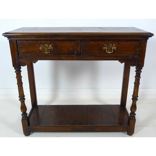 913 - A 19th century oak hall table, with two frieze drawers, brass plate swan neck handles, cock beading,... 