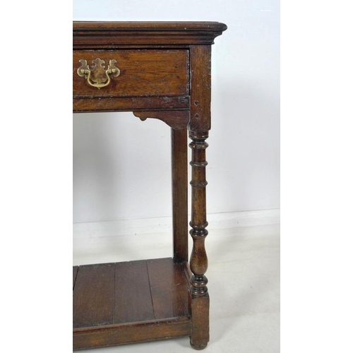 913 - A 19th century oak hall table, with two frieze drawers, brass plate swan neck handles, cock beading,... 