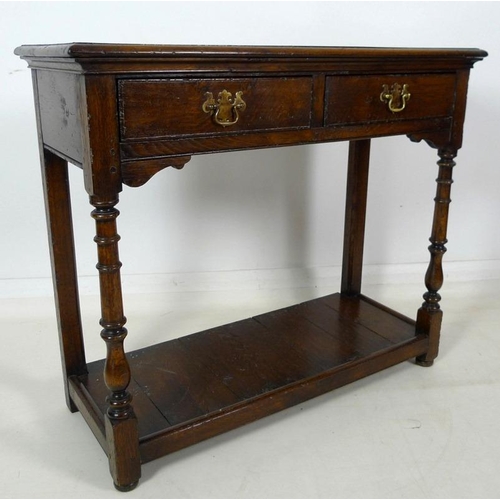 913 - A 19th century oak hall table, with two frieze drawers, brass plate swan neck handles, cock beading,... 