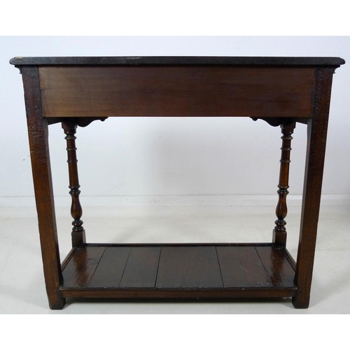 913 - A 19th century oak hall table, with two frieze drawers, brass plate swan neck handles, cock beading,... 