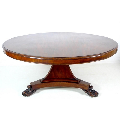 914 - An early Victorian mahogany breakfast table, the circular tilt top supported on a tapering column an... 