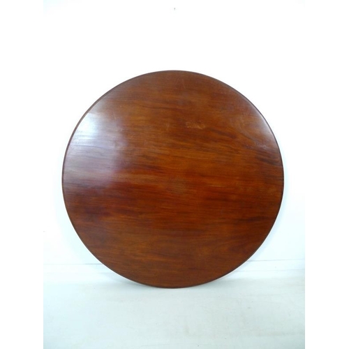 914 - An early Victorian mahogany breakfast table, the circular tilt top supported on a tapering column an... 