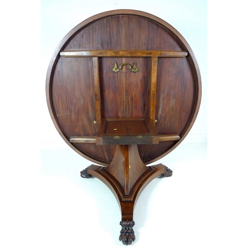 914 - An early Victorian mahogany breakfast table, the circular tilt top supported on a tapering column an... 