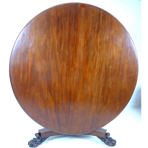 914 - An early Victorian mahogany breakfast table, the circular tilt top supported on a tapering column an... 