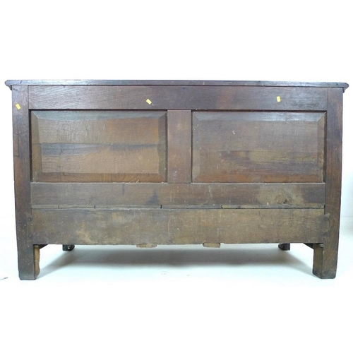 915 - An Georgian oak mule chest, lift lid over four panel front, three drawers below with brass swan neck... 