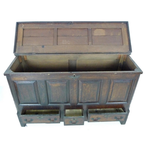 915 - An Georgian oak mule chest, lift lid over four panel front, three drawers below with brass swan neck... 