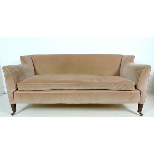 916 - An Edwardian two seater settee, with low wing back, upholstered in pale pink velvet, raised on taper... 