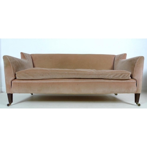 916 - An Edwardian two seater settee, with low wing back, upholstered in pale pink velvet, raised on taper... 