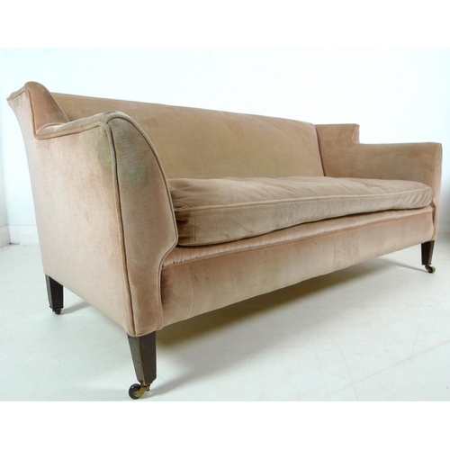 916 - An Edwardian two seater settee, with low wing back, upholstered in pale pink velvet, raised on taper... 