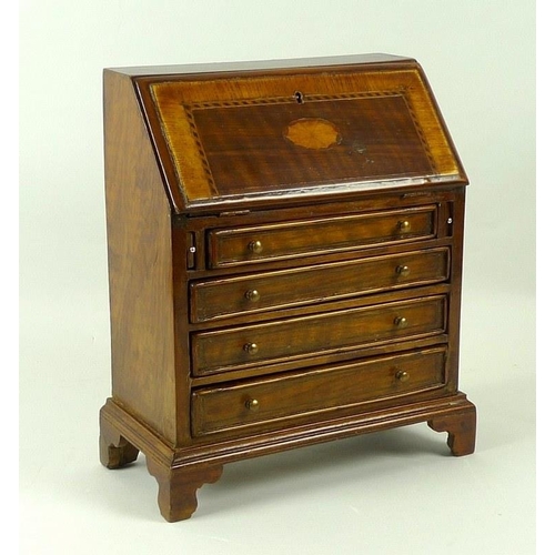 917 - A mid to early 20th century mahogany Journeyman's bureau, the fall front with satinwood fan patera, ... 