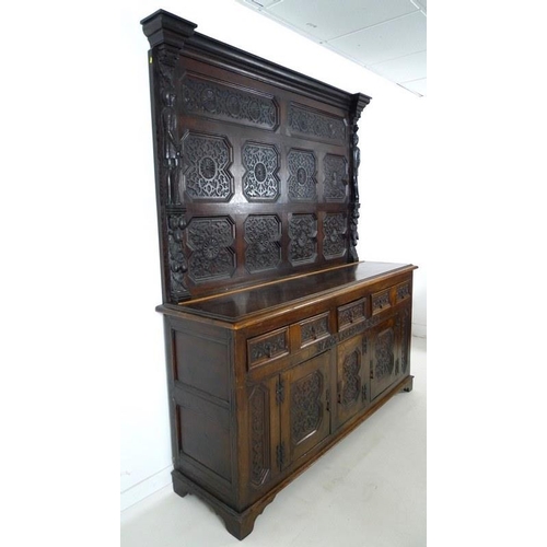 918 - An oak dresser base, parts 18th century and later, frieze carved 'Jacobvs Rex 1688', two wide and on... 