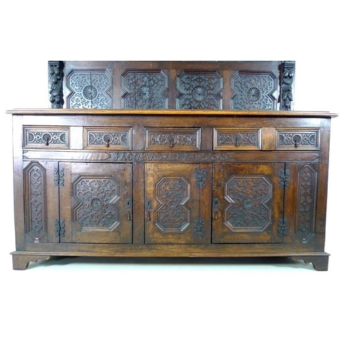 918 - An oak dresser base, parts 18th century and later, frieze carved 'Jacobvs Rex 1688', two wide and on... 