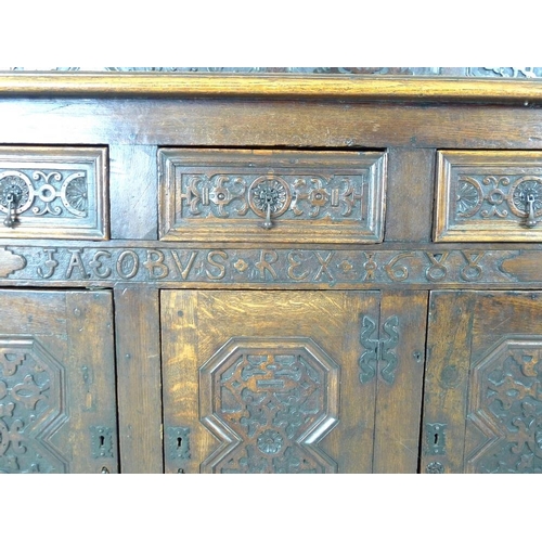 918 - An oak dresser base, parts 18th century and later, frieze carved 'Jacobvs Rex 1688', two wide and on... 