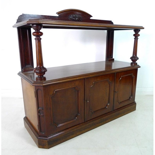 921 - An early Victorian mahogany buffet, with shaped upstand on an upper tier shelf, carved, turned and f... 