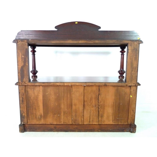 921 - An early Victorian mahogany buffet, with shaped upstand on an upper tier shelf, carved, turned and f... 