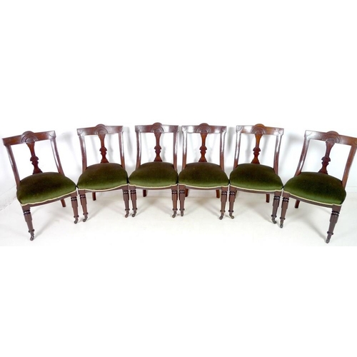 924 - A set of six Victorian Aesthetic mahogany dining chairs, bowed backs with carved decoration, upholst... 