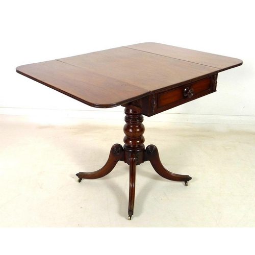 925 - A Regency mahogany sofa table, drop leaves, single drawer opposite false drawer with turned handle, ... 