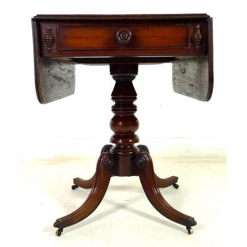 925 - A Regency mahogany sofa table, drop leaves, single drawer opposite false drawer with turned handle, ... 