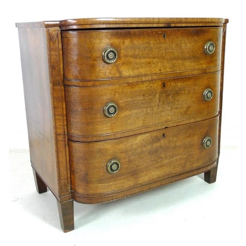 927 - A George IV mahogany, crossbanded and inlaid bow fronted chest of three graduating drawers, with bra... 