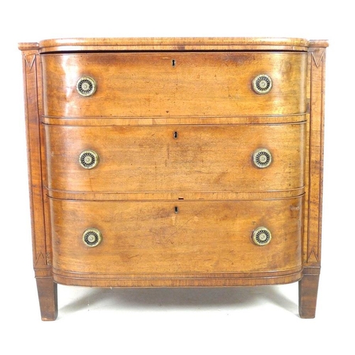 927 - A George IV mahogany, crossbanded and inlaid bow fronted chest of three graduating drawers, with bra... 