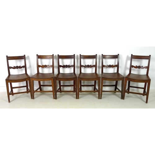 928 - A set of six Georgian mahogany dining chairs, with bar back top rails, rosette carved mid rails, lin... 