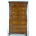 A George I walnut and crossbanded tallboy chest on chest, the top section with three short over thre... 