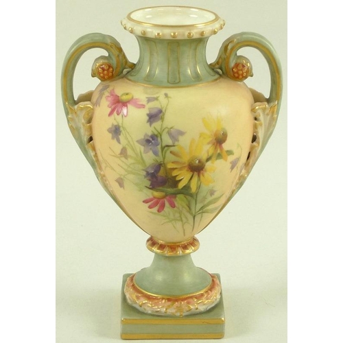 528 - A Royal Worcester blush ivory twin handled vase of ovoid form with scrolled handles, the body painte... 