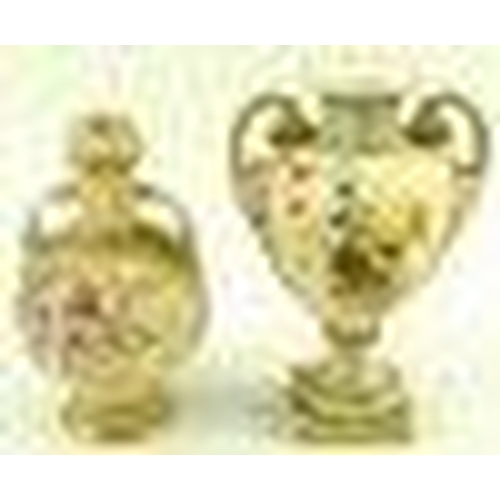 528 - A Royal Worcester blush ivory twin handled vase of ovoid form with scrolled handles, the body painte... 