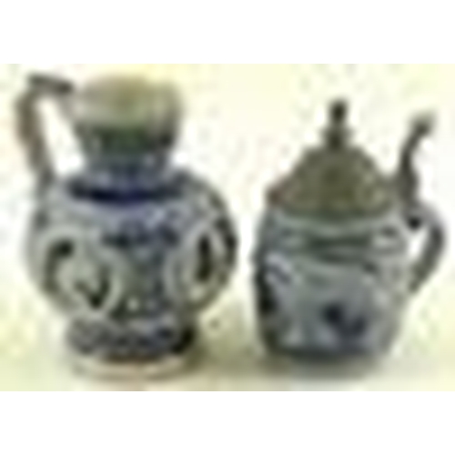 536 - A Westerwald salt glazed grey stoneware tankard with pewter cover, 13.5cm, and a German stoneware ju... 