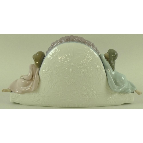 537 - A Lladro clock with figures either side, model 5776, 'Two Sisters', together with a bisque Lladro be... 