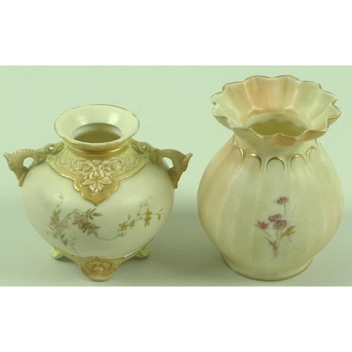 538 - A Royal Worcester blush ivory twin handled vase of squat form with dolphin handles, the body painted... 