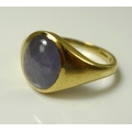 An 18ct gold and star sapphire ring, of signet form, set with a large oval cabochon star sapphire, 1... 