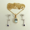 A sapphire and gold pendant, the pale oval cut stone 8 by 6mm, on a 9ct gold chain, together with a ... 
