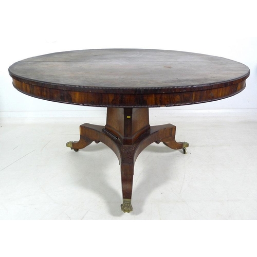 1004 - A Victorian rosewood and mahogany veneered breakfast table, circular tilt top surface with beaded ed... 