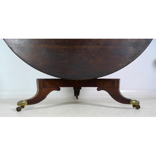 1004 - A Victorian rosewood and mahogany veneered breakfast table, circular tilt top surface with beaded ed... 