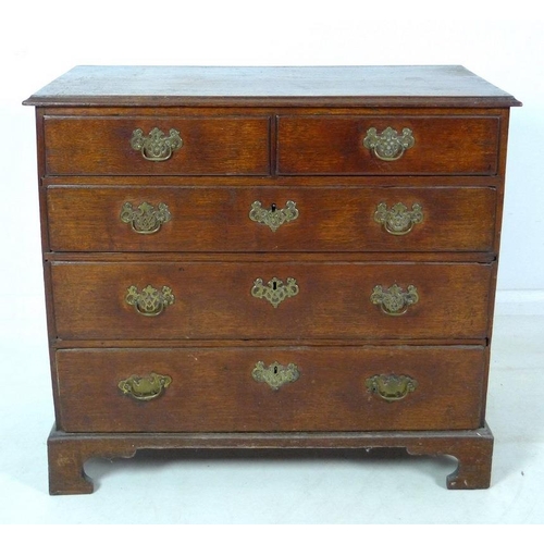 1005 - A George III oak chest of two short over three long graduating drawers, surface with moulded edge, p... 