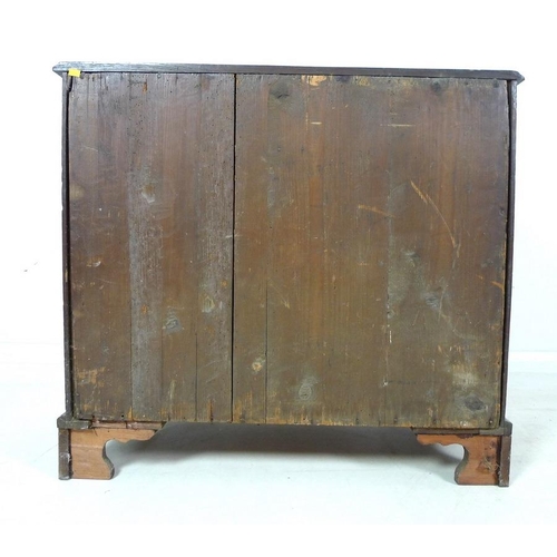 1005 - A George III oak chest of two short over three long graduating drawers, surface with moulded edge, p... 