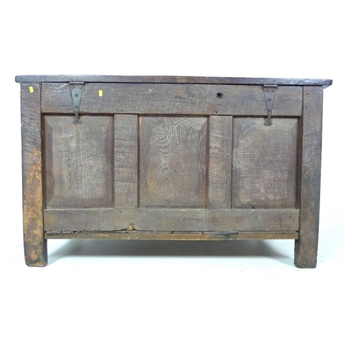 1006 - An 18th century oak coffer or blanket box, inlaid with chevron detailing, three arched panels to the... 