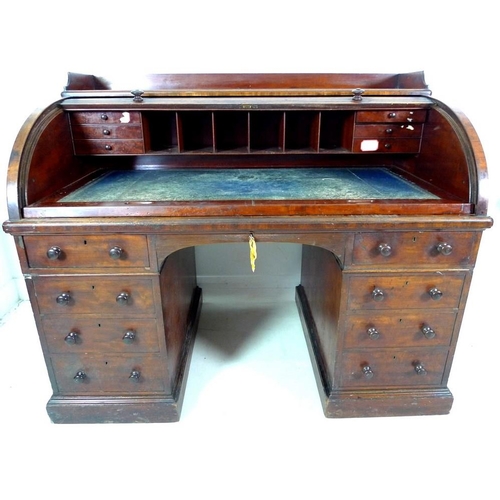 1009 - An early Victorian mahogany twin pedestal desk, by Holland & Sons, tambour roll top enclosing a fitt... 