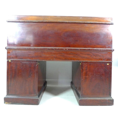 1009 - An early Victorian mahogany twin pedestal desk, by Holland & Sons, tambour roll top enclosing a fitt... 