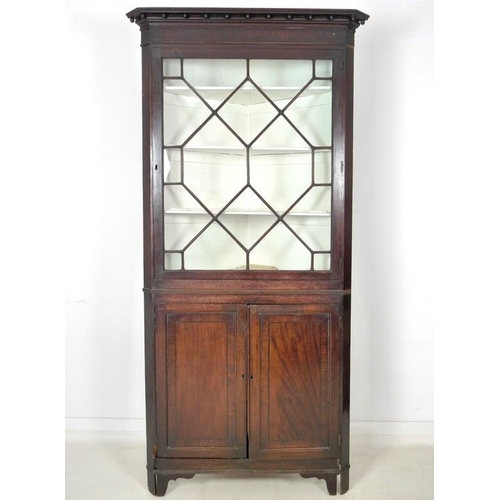 1012 - A George III mahogany corner cupboard, with astragal glazed single door above, enclosing three fixed... 