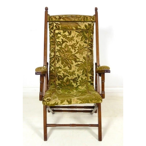 1015 - A Victorian mahogany reclining open armchair, with brass fittings and ratcheted reclining action, up... 