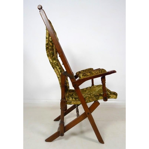 1015 - A Victorian mahogany reclining open armchair, with brass fittings and ratcheted reclining action, up... 