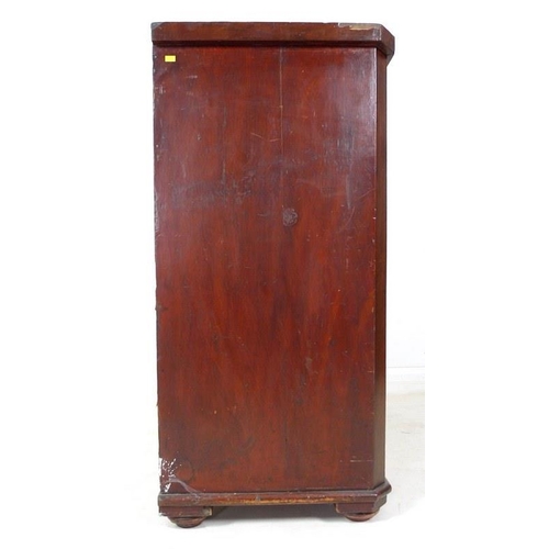 1017 - A Victorian flame mahogany veneered chest of two short over three long graduating drawers, with turn... 