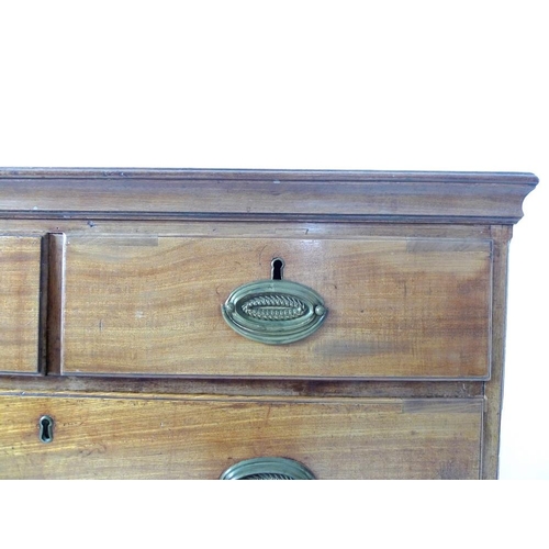 1019 - A George III mahogany chest of two short over three long graduating drawers, with brass oval plate h... 