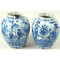 A pair of Dutch Delft blue and white tin glazed pottery vases, 18th century, of lobed octagonal form... 