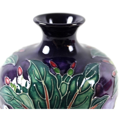 504 - A Moorcroft ovoid vase, slim neck with flared rim, 16cm, together with a Moorcroft small shallow dis... 