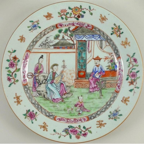 507 - A Chinese famille rose porcelain plate, Qing Dynasty, 18th century, decorated with a musician playin... 