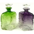 Attributed to Ludwig Moser (1833-1916): a pair of Bohemian Intaglio cut glass decanters and stoppers... 